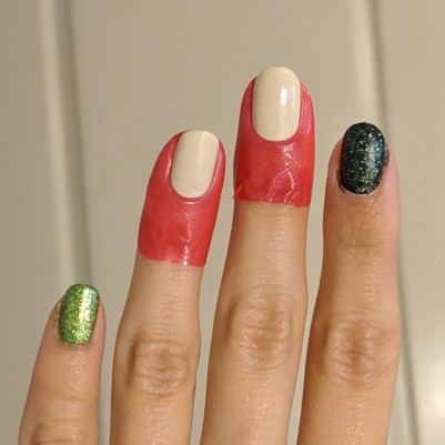 Nail tape around the nails to be watermarbled, with the other nails painted different greens